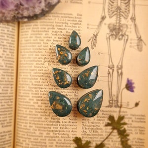 a pair of ear buttons | Emerald * Drop | Plugs tunnels