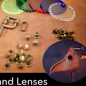 May include: A set of metal hardware and clear plastic lenses for crafting a leather mask. The hardware includes buckles, rivets, and eyelets. The lenses are in various colors, including green, red, and blue. The text "Every metal piece needed to finish the design included printed paper pattern available upon request" is visible in the image.
