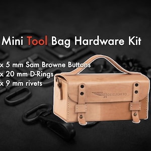 May include: A light brown leather tool bag with a flap closure and metal hardware. The bag has a logo that says "DIESELPUKE RO". The bag is surrounded by black metal hardware, including D-rings, rivets, and buttons.