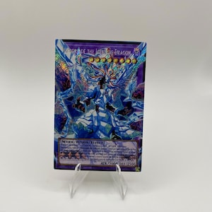 May include: A holographic Yu-Gi-Oh! trading card titled Mirrorjade the Iceblade Dragon. The card features a central blue and white dragon-like figure surrounded by crystalline shards. It displays the text Wyrm/Fusion/Effect, ATK/3000, and DEF/2500.