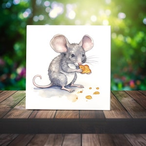 May include: A watercolor painting of a gray mouse holding a cookie. The mouse is sitting on a white background with a few crumbs scattered around it.