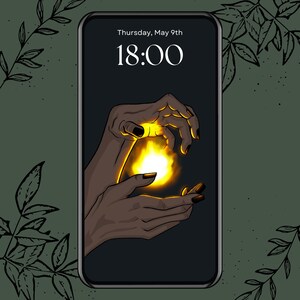May include: Smartphone screen showing a digital illustration of hands holding a bright yellow flame. The time is 18:00, with the date Thursday, May 9th displayed above. The background is dark with green foliage.