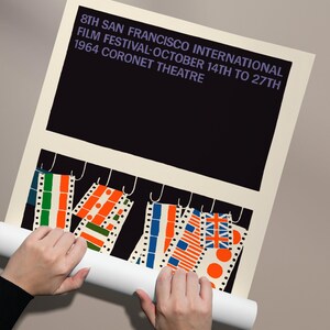 A poster for the 8th San Francisco International Film Festival, featuring a large black background with text and a colorful abstract design below.