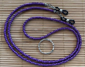 Eyeglass chain; purple glass seed beads; silicone grips; lobster clasp; 25&quot; long.