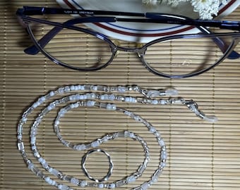 Eyeglass chain, white on white and clear glass seed beads.  Silicone grips and a dangle.  25&quot; long.