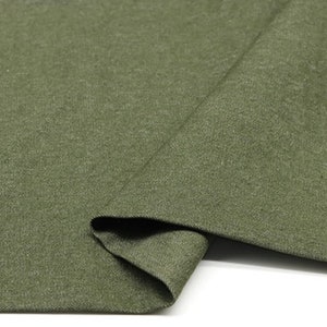 May include: A close-up of a piece of green fabric. The fabric has a textured surface and is folded in half. The number "3#" is written in white on the fabric.