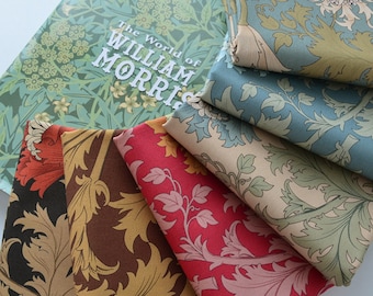 May include: A collection of patterned fabrics and a book titled "The World of William Morris." The fabrics display floral and leaf designs in shades of red, brown, gold, and blue. The book cover features a green floral pattern.