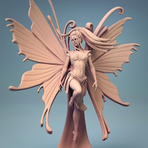 May include: A detailed figurine of a fairy with large butterfly wings. The fairy is sculpted in a nude pose with flowing hair and intricate details on her wings.