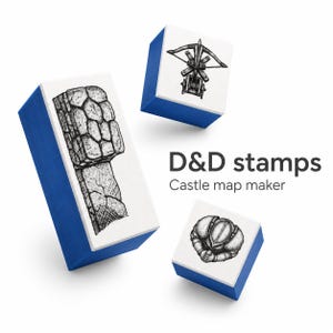 May include: Three blue and white rubber stamps for map making, featuring black ink illustrations of a stone wall, a crossbow, and a suit of armour. The text D&D stamps Castle map maker is printed in black next to the stamps on a white background.