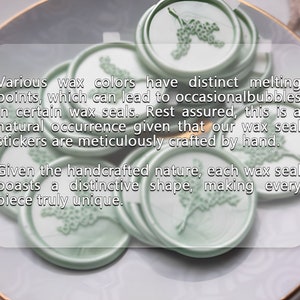 May include: A close-up of several green wax seals with a floral design. The text reads: "Various wax colors have distinct melting points, which can lead to occasional bubbles in certain wax seals. Rest assured, this is a natural occurrence given that our wax seal stickers are meticulously crafted by hand. Given the handcrafted nature, each wax seal boasts a distinctive shape, making every piece truly unique."