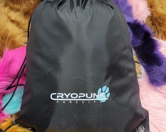 May include: Black drawstring bag with the text "Cryopunk Fursuits" in white and blue. The bag is sitting on a pile of colorful faux fur.