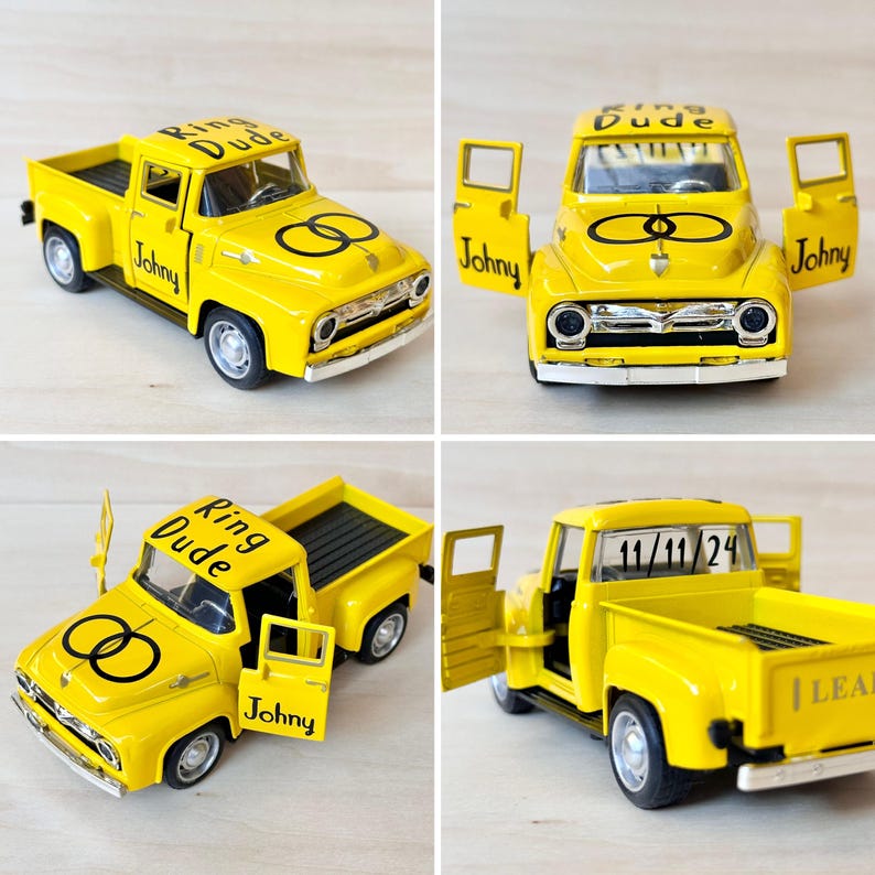 May include: Yellow toy pickup truck with black lettering that says "Ring Dude" and "Johnny". The truck has two rings on the hood and the doors are open.