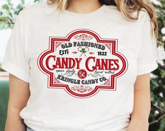 Camicia natalizia retrò, camicia con bastoncino di zucchero, abbigliamento per le vacanze, Kringle Candy Co., camicia di Natale divertente, maglietta di Natale, camicia di caramelle natalizie