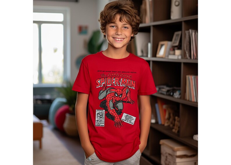 May include: A red t-shirt with a graphic of Spider-Man from a comic book cover. The text on the shirt reads "The Amazing Spider-Man".