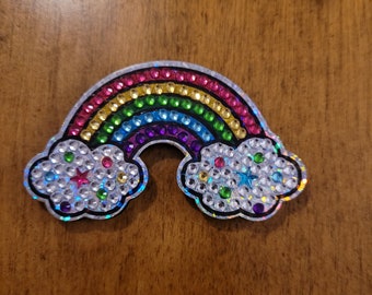 Koelkastmagneet regenboog met witte wolken