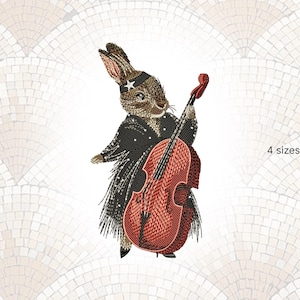 Puede incluir: Diseño bordado de un conejo con chaqueta negra de lunares blancos, tocando un violonchelo rojo. El conejo lleva una diadema en forma de estrella. Disponible en 4 tamaños.
