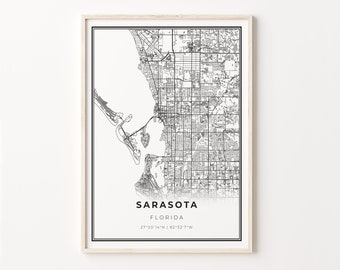 May include: Black and white map print of Sarasota, Florida. The map shows the city streets and surrounding area. The text "Sarasota, Florida 27°20'14"N | 82°32'7"W" is printed below the map.
