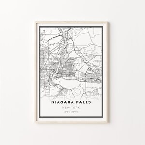 May include: Black and white line art map of Niagara Falls, New York. The map shows the city streets and the Niagara River. The text "NIAGARA FALLS" is at the bottom of the map, along with "NEW YORK" and the coordinates "43°6'N | 79°1'W".