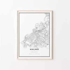 May include: Black and white map print of Malmö, Sweden with the city name and coordinates "55°36'21"N | 13°02'09"E" printed below the map.