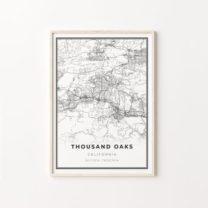 May include: Black and white map print of Thousand Oaks, California. The map shows the city's streets and roads. The text "Thousand Oaks, California" and the coordinates "34°11'22"N | 118°52'30"W" are printed below the map.