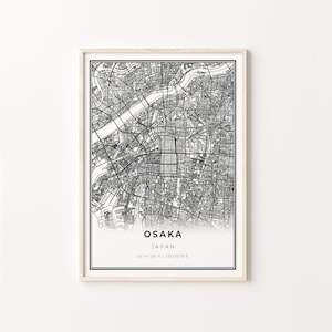 May include: Black and white map print of Osaka, Japan with the city name and coordinates "34°41'38"N | 135°30'8"E" printed below the map.