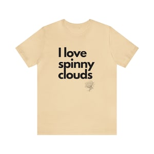 May include: A light beige t-shirt with the text "I love spinny clouds" in black. A small black and white illustration of a tornado is below the text.