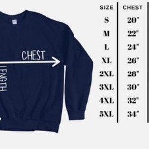 May include: A navy blue sweatshirt with size chart showing chest, length, and sleeve length measurements in inches.