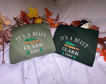 It's a Beaut Clark Embroidered Christmas Sweatshirt
