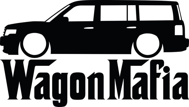 May include: Black silhouette of a station wagon with large white wheels. The text "WagonMafia" is displayed in a bold, stylized font below the car. The image is a simple, graphic design.