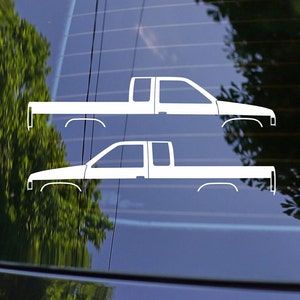 May include: Two white silhouette decals of a pickup truck. The decals are on a blue background.
