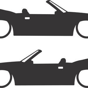 May include: Two black convertible car silhouettes with white wheels are depicted against a white background. The cars have their tops down, showcasing their sleek, classic design. The image is a simple, graphic representation.
