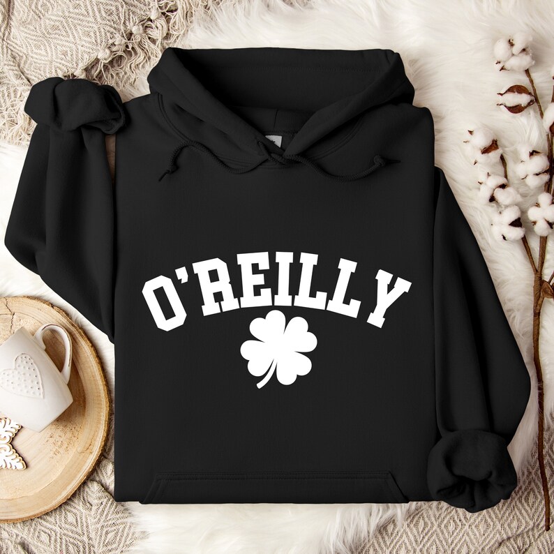 May include: Black hooded sweatshirt with a white shamrock and the text "O'Reilly" in a white arched font.