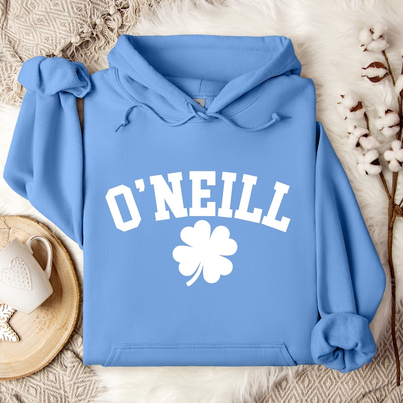 May include: A light blue hoodie with a white shamrock and the text "O'NEILL" in white.