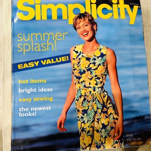 May include: A magazine cover for Simplicity featuring a woman wearing a yellow and blue floral print dress. The cover text reads "summer splash! EASY VALUE!" and "8965 easy to sew".