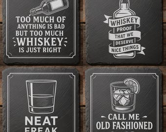 May include: Set of four square black slate coasters with white text and illustrations. Designs include a whiskey bottle, a glass of whiskey, and humorous quotes about whiskey and cocktails. Great for home bars.