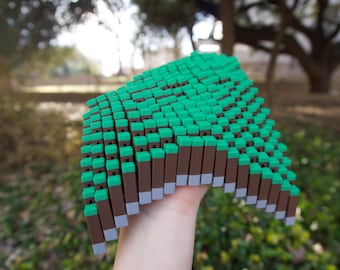 Píxeles antiestrés con terreno herboso - Impresión 3D