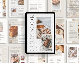 May include: A digital cookbook with a beige background and a white cover with the word "Cookbook" in a large, elegant font. The cover features a photo of a loaf of bread on a wire rack. The cookbook is open to a page with a recipe for homemade macarons.