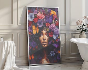 May include: A framed art print featuring a woman's portrait with a floral and butterfly crown. The artwork showcases a woman with dark hair and skin, surrounded by colorful flowers and butterflies in shades of purple, pink, orange, and blue.