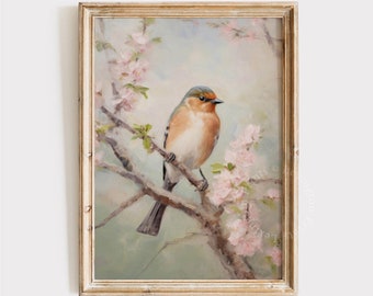 May include: A framed print featuring a detailed painting of a bird perched on a branch with pink blossoms. The bird has orange, brown, and gray feathers. The frame is gold-colored, and the print has a vintage aesthetic. The text "LEXINGTON PRINTS" is at the bottom.