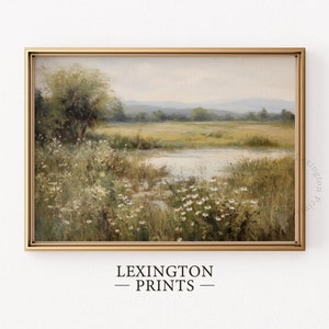 Vintage Spring wall art wildflower field art print landscape painting. It is displayed in an antique frame. This Spring decor can also be Easter decor. The painting features intricate brushwork and colors. The shop name Lexington Prints is written