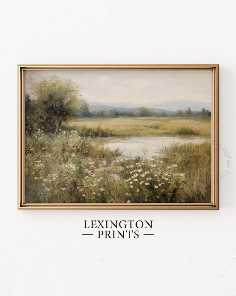 Vintage Spring wall art wildflower field art print landscape painting. It is displayed in an antique frame. This Spring decor can also be Easter decor. The painting features intricate brushwork and colors. The shop name Lexington Prints is written