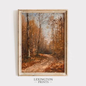 May include: A framed painting of an autumnal forest scene. The artwork shows a path through trees in shades of brown and orange. The frame is gold-toned. The text "LEXINGTON PRINTS" is at the bottom of the image.