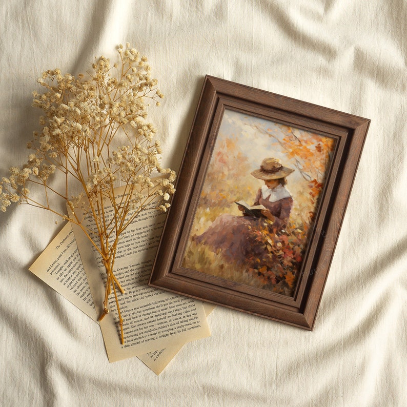 Vintage fall woman reading book fall painting oil painting art print displayed in an antique frame against a white background. The painting features intricate brushwork and colors. The shop name Lexington Prints is written out beneath the wall art.