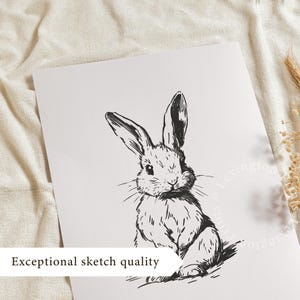 Vintage black sketch wall art of a cute easter bunny rabbit. The sketch art print features thick black sketch work against a simple off white background. The sketch is a minimalist drawing fits an aesthetic for spring decor, easter decor, nursery decor, and rustic farmhouse decor. The shop name LexingtonPrints is written below