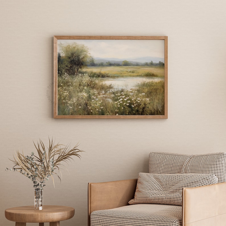 Vintage Spring wall art wildflower field art print landscape painting. It is displayed in an antique frame. This Spring decor can also be Easter decor. The painting features intricate brushwork and colors. The shop name Lexington Prints is written