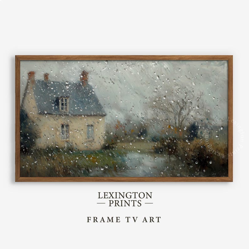 Vintage Spring Frame TV art for the Samsung Frame TV of a dark moody raining spring landscape as seen from the glass of a window. There are water droplets on the window. The artwork features neutral gray and brown tones. This Spring wall art decor is meant to be displayed in a Frame TV and it can also be used as farmhouse decor or cottagecore decor. The shop name Lexington Prints is listed below.