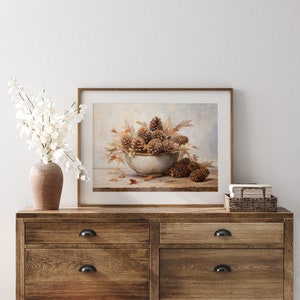 Fall Vintage fall pinecone decor painting oil painting art print displayed in an antique frame against a white background. The painting features intricate brushwork and colors. The shop name Lexington Prints is written out beneath the wall art frame