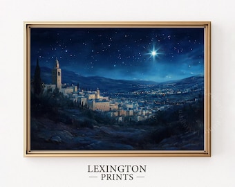 May include: A framed print depicting a nighttime cityscape under a starry sky, with a bright star shining above. The artwork features a town with illuminated buildings and a tall tower. The frame is gold, and the text "LEXINGTON - PRINTS" is at the bottom.