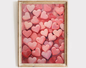 May include: A framed painting of a collection of pink hearts. The hearts are arranged in a random pattern and are all different sizes. The background is a light pink color.