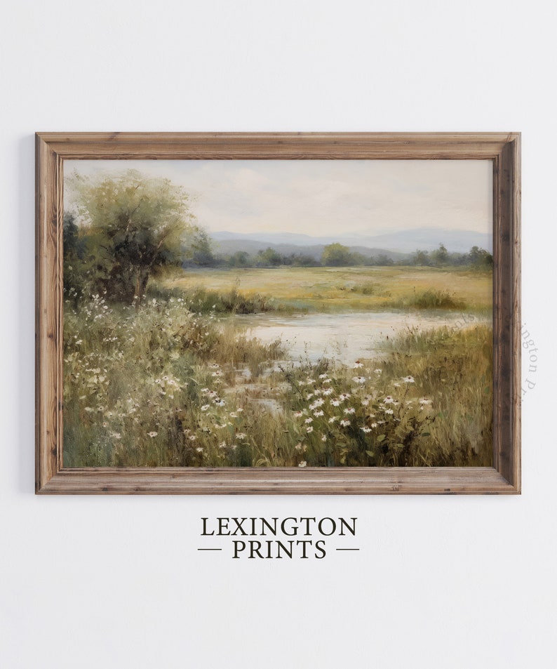 Vintage Spring wall art wildflower field art print landscape painting. It is displayed in an antique frame. This Spring decor can also be Easter decor. The painting features intricate brushwork and colors. The shop name Lexington Prints is written